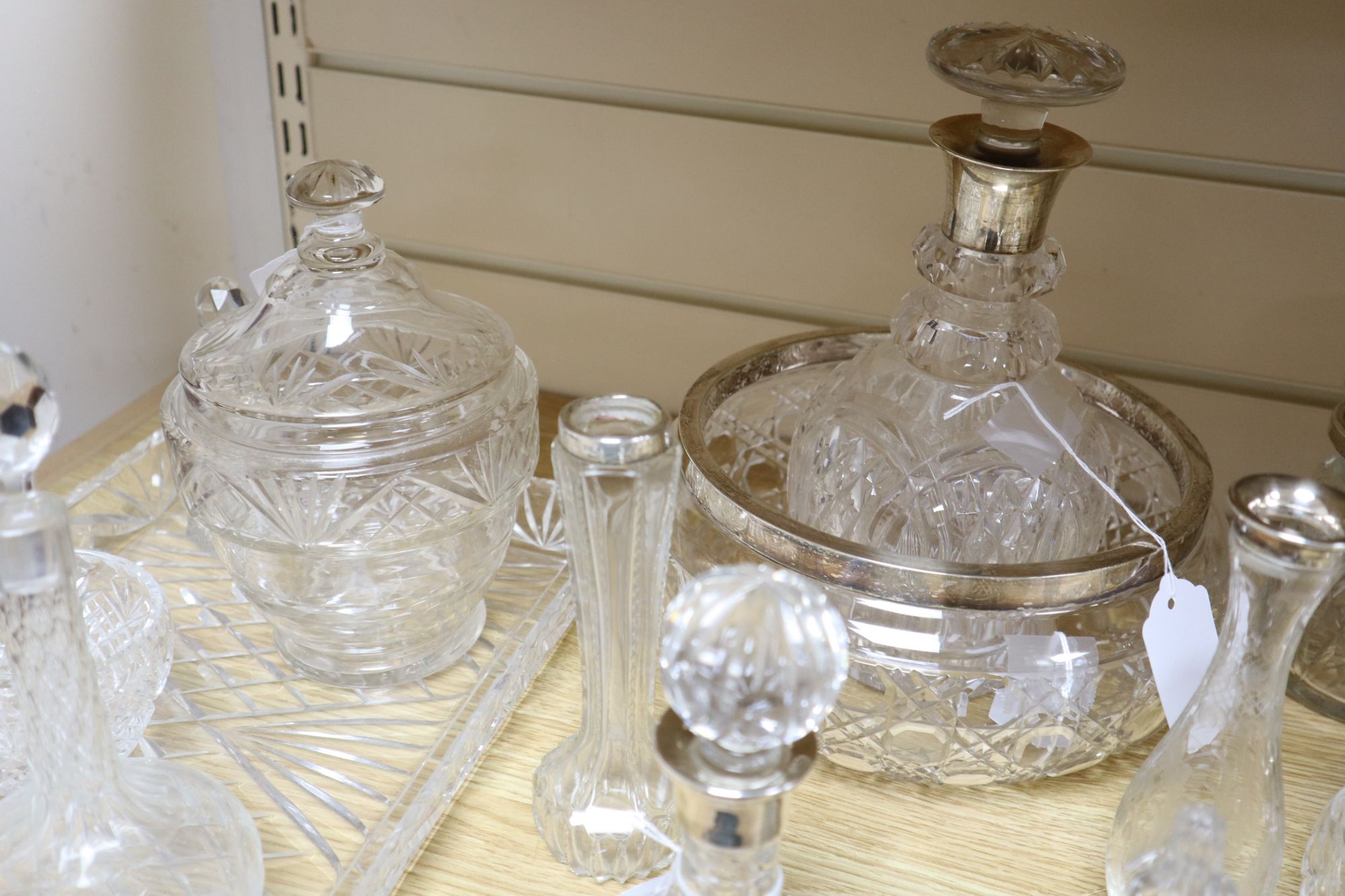 A collection of silver-mounted and other cut glass items,